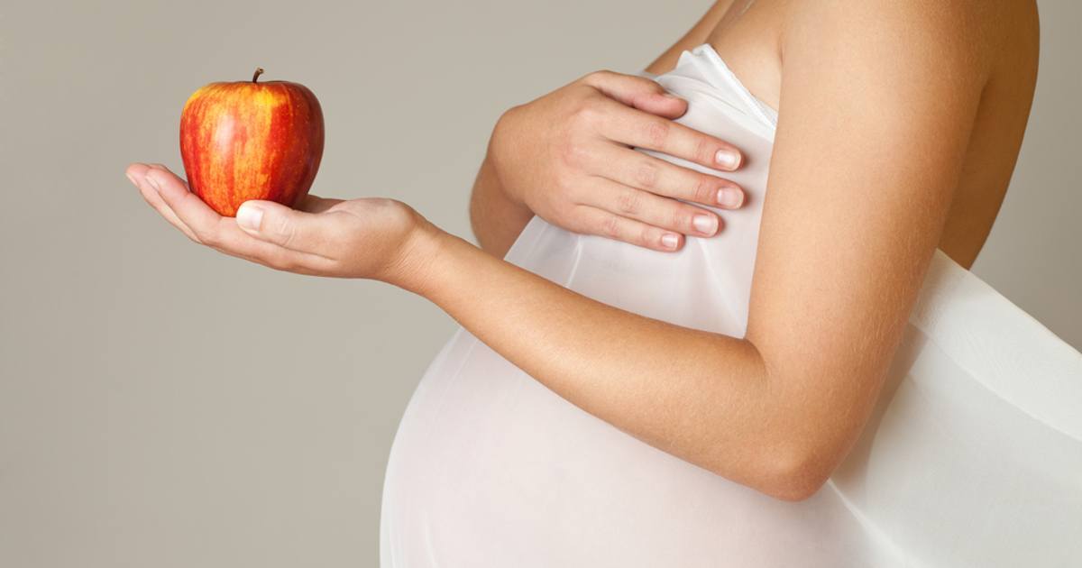 pregnant-woman-holding-apple-facebook.jpg